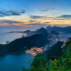 aerial photography of mountains surrounded by sea