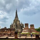 Ancient temple ruins under a cloudy sky