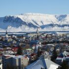bird's eye photography of city near snow mountain