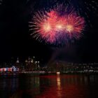 Fireworks light up over a city skyline